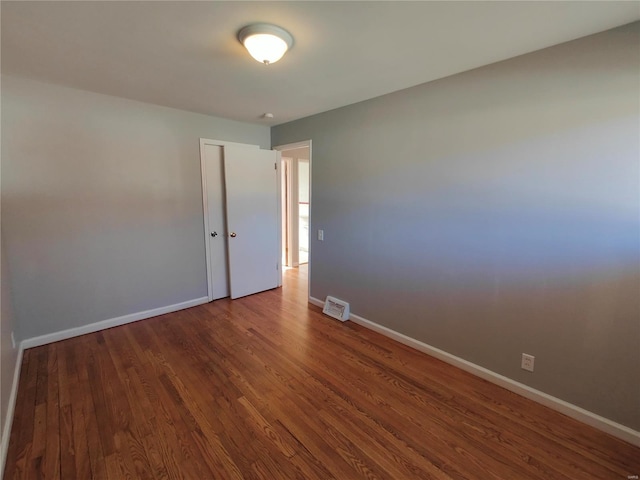 spare room featuring hardwood / wood-style flooring