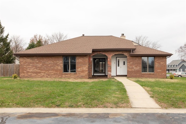 ranch-style home featuring a front yard