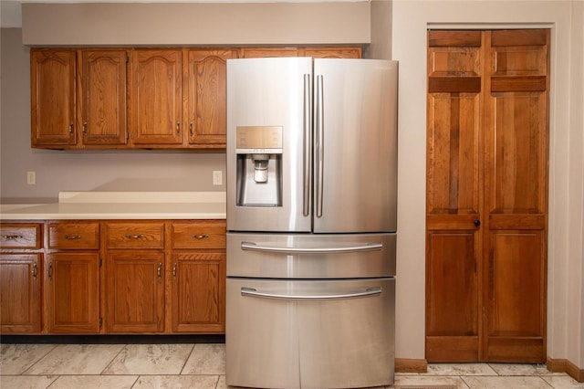 kitchen featuring stainless steel fridge