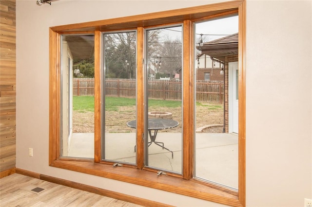 doorway with light wood-type flooring