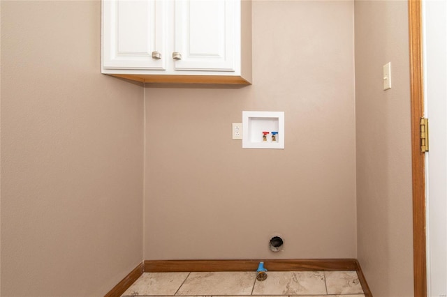 clothes washing area featuring washer hookup, hookup for an electric dryer, cabinets, and light tile patterned floors