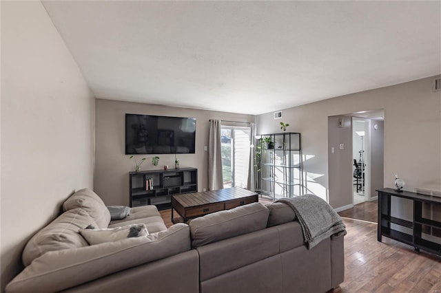 living room with hardwood / wood-style flooring