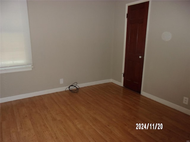 unfurnished room featuring hardwood / wood-style floors