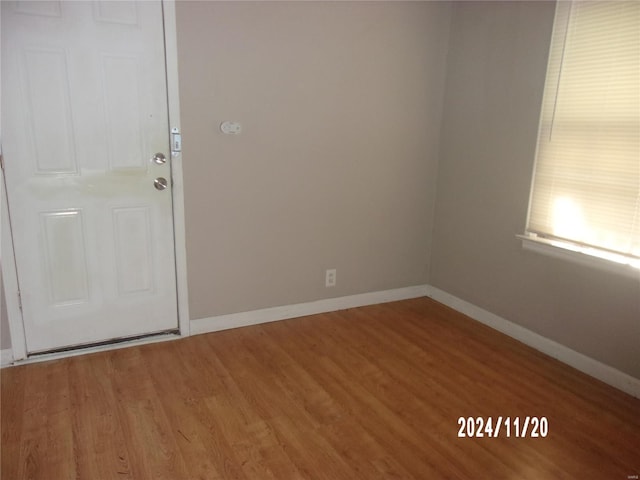 empty room with hardwood / wood-style floors