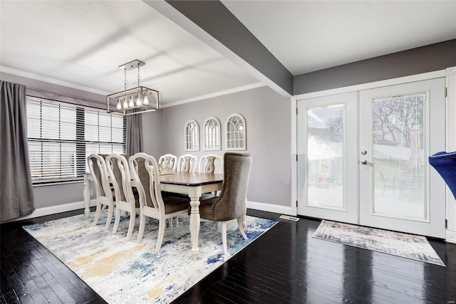 dining space featuring dark hardwood / wood-style flooring, french doors, and ornamental molding