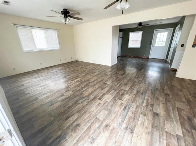 empty room with dark hardwood / wood-style flooring and ceiling fan