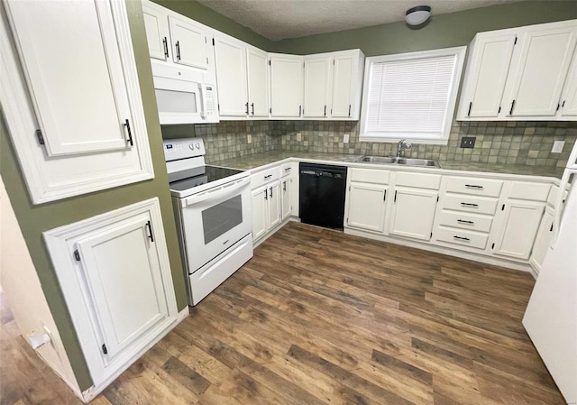 kitchen with tasteful backsplash, white appliances, sink, white cabinets, and dark hardwood / wood-style floors