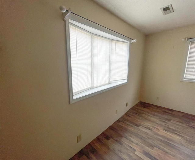 empty room featuring wood-type flooring