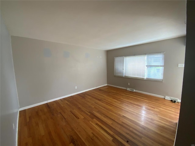 empty room featuring hardwood / wood-style flooring