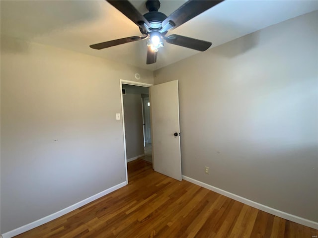 unfurnished bedroom featuring ceiling fan and wood-type flooring