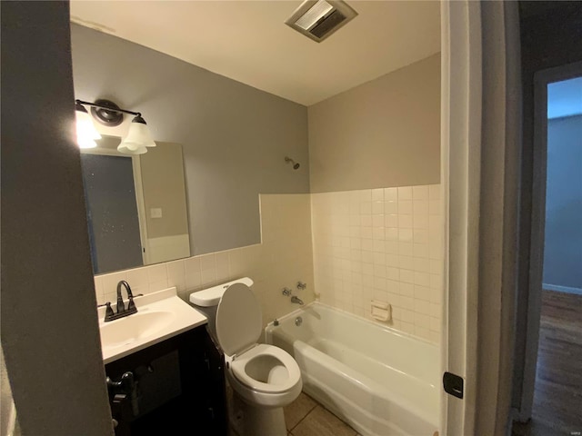 bathroom with a tub, tile patterned flooring, vanity, and toilet