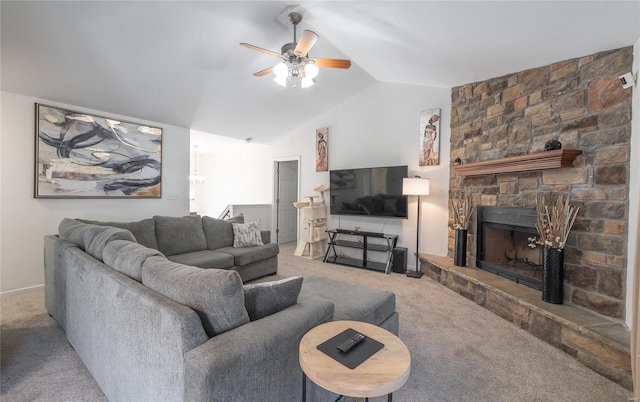 living room featuring lofted ceiling, carpet floors, ceiling fan, and a stone fireplace