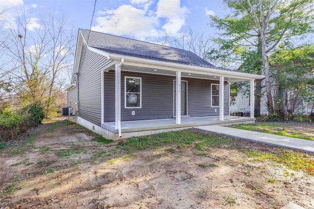 view of front of home with cooling unit and covered porch