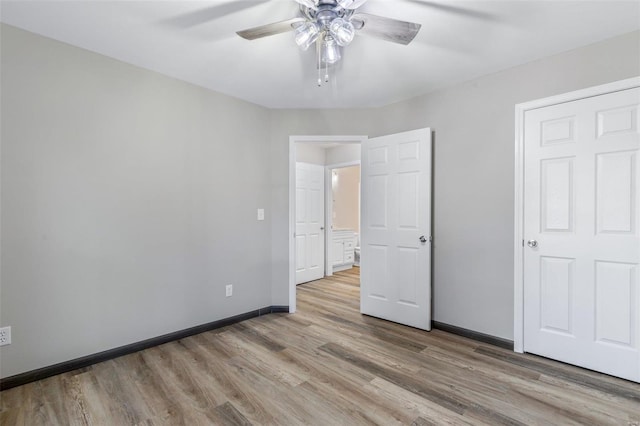 unfurnished bedroom featuring ceiling fan and light wood-type flooring