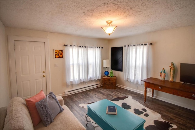 living room with a textured ceiling, dark hardwood / wood-style floors, and baseboard heating