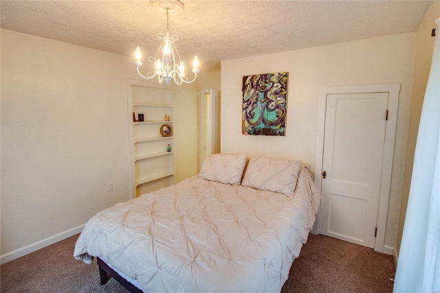 bedroom with carpet, a notable chandelier, and a textured ceiling