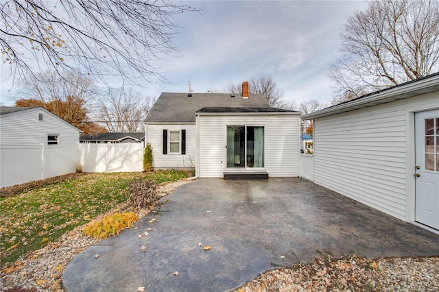 back of property with a patio area