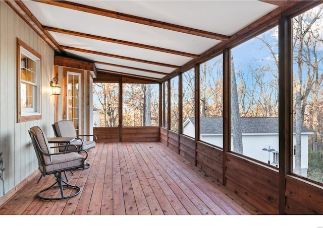 sunroom with beamed ceiling and plenty of natural light