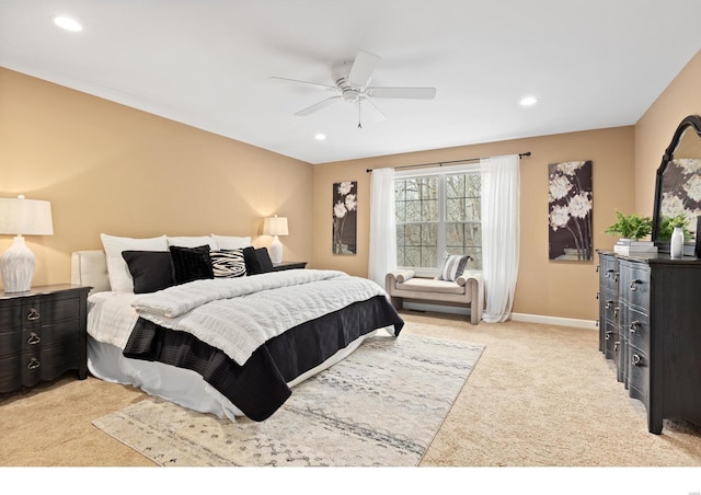 bedroom featuring light carpet, ceiling fan, baseboards, and recessed lighting