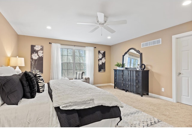 bedroom featuring baseboards, visible vents, carpet flooring, and multiple windows