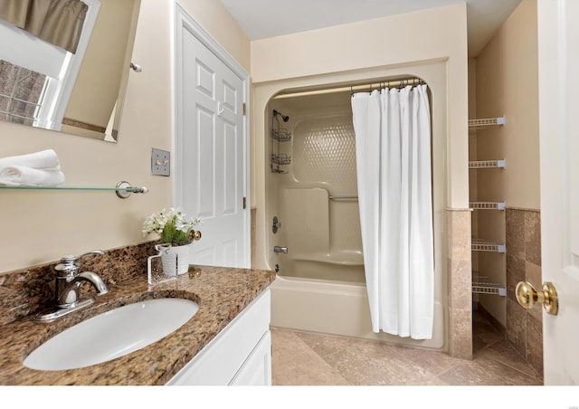 bathroom featuring tile patterned floors, vanity, and shower / bathtub combination with curtain