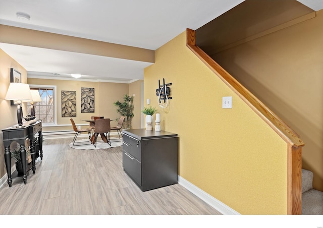 interior space with stairs, baseboards, and light wood-style floors