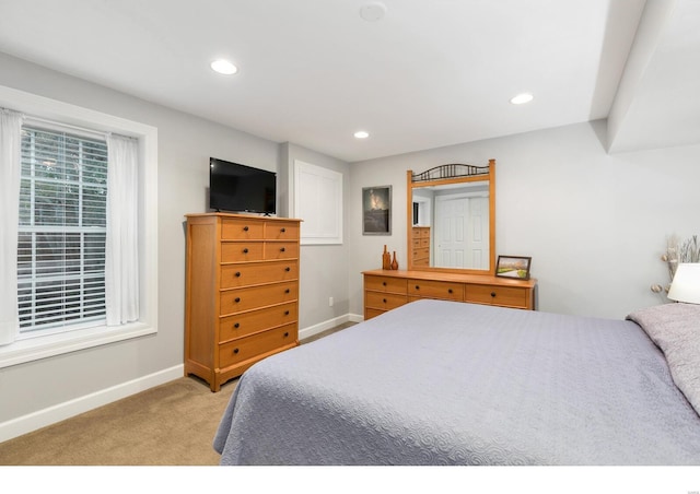 bedroom with recessed lighting, baseboards, and light colored carpet