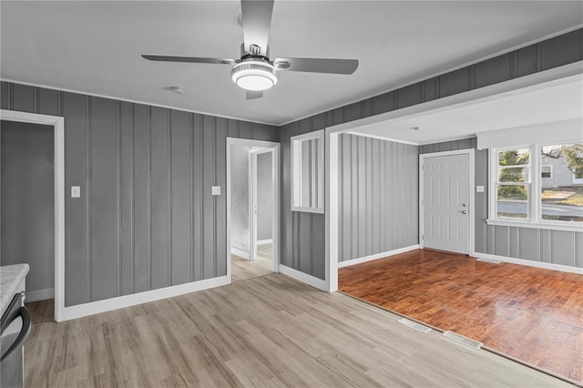 interior space featuring light hardwood / wood-style floors and ceiling fan