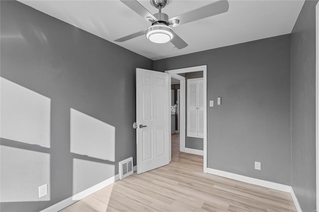 unfurnished bedroom featuring ceiling fan and light wood-type flooring