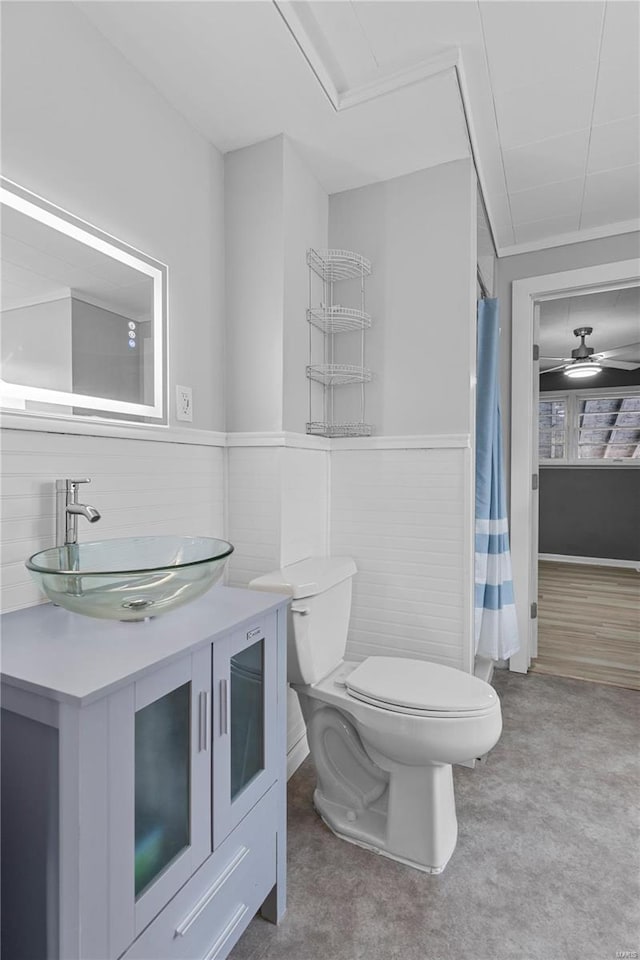 bathroom with vanity, ceiling fan, and toilet