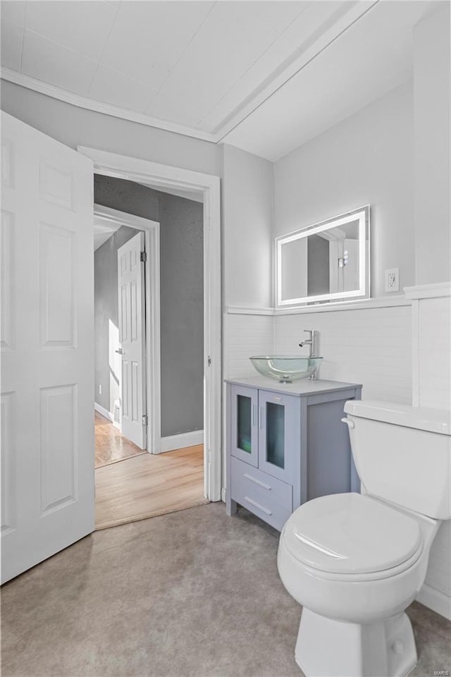 bathroom featuring hardwood / wood-style floors, toilet, and sink