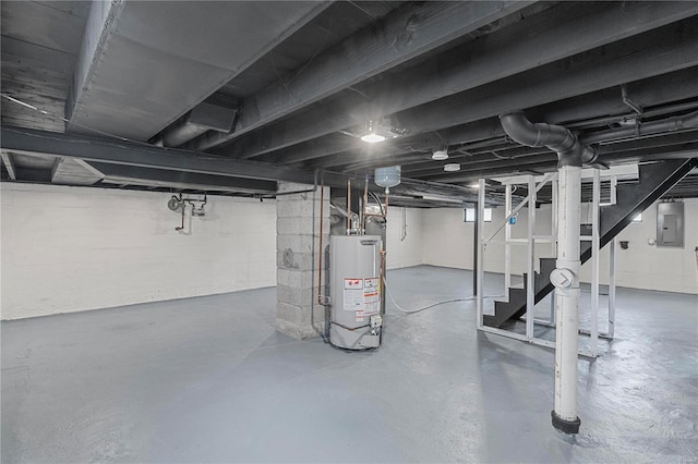 basement with electric panel and gas water heater