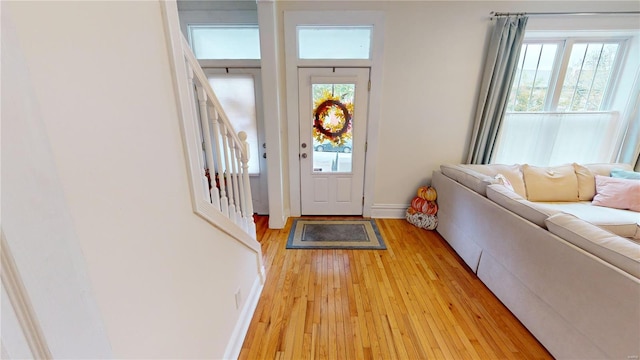 foyer entrance with light hardwood / wood-style floors