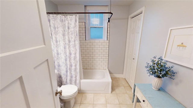 bathroom featuring tile patterned flooring, toilet, and shower / tub combo