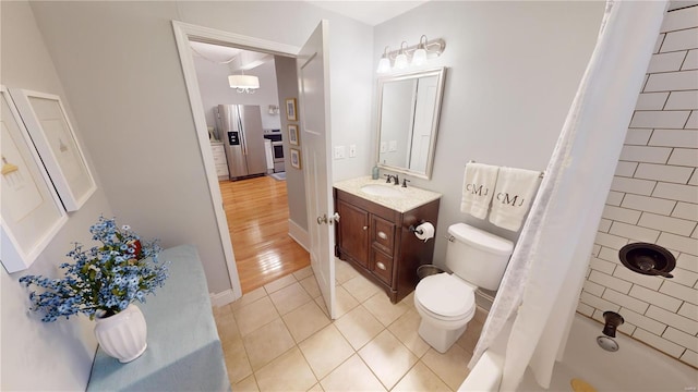 full bathroom with shower / tub combo with curtain, vanity, wood-type flooring, and toilet