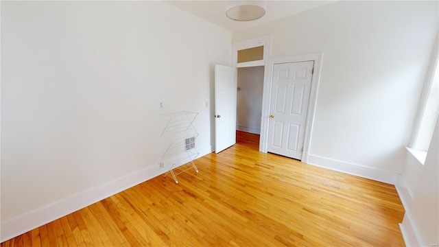 spare room featuring light wood-type flooring