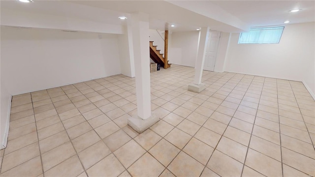 basement with light tile patterned flooring