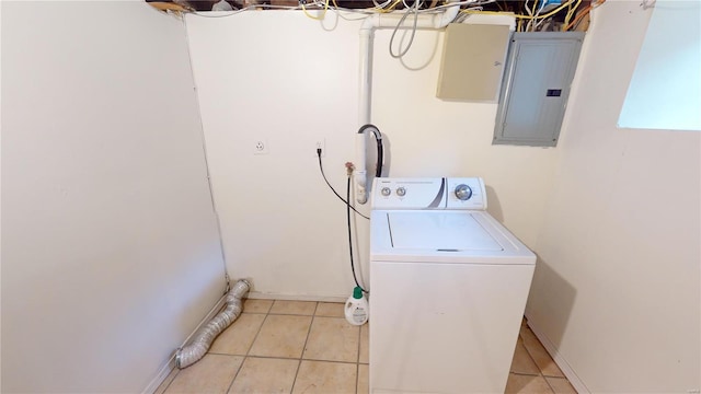 laundry room with light tile patterned flooring, washer / dryer, and electric panel