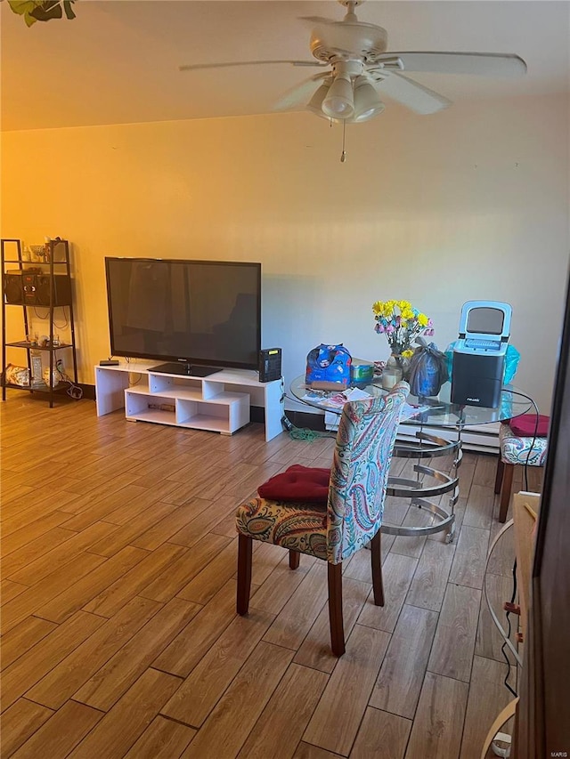 interior space with hardwood / wood-style flooring and ceiling fan