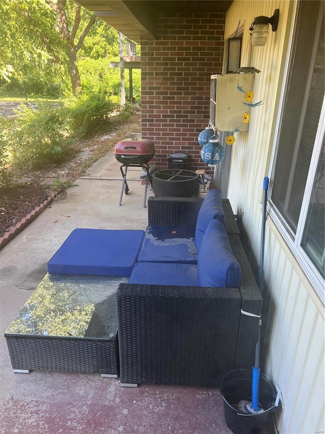 view of patio with outdoor lounge area and area for grilling