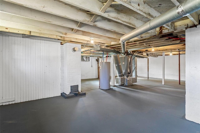 basement featuring heating unit and water heater