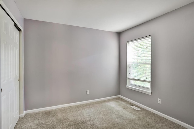 spare room featuring carpet floors