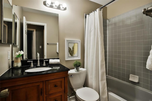 full bathroom featuring vanity, toilet, and shower / bathtub combination with curtain