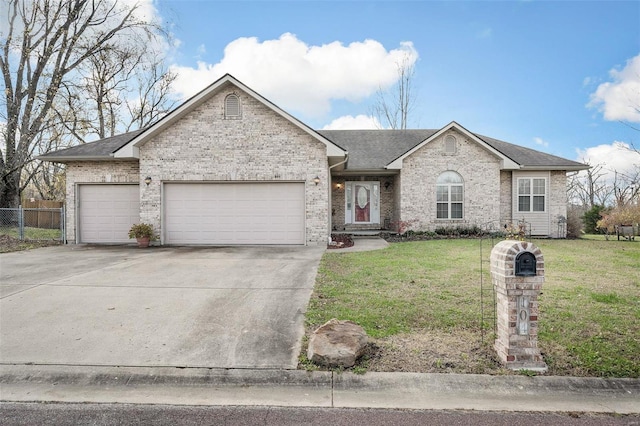 ranch-style house featuring a garage and a front yard