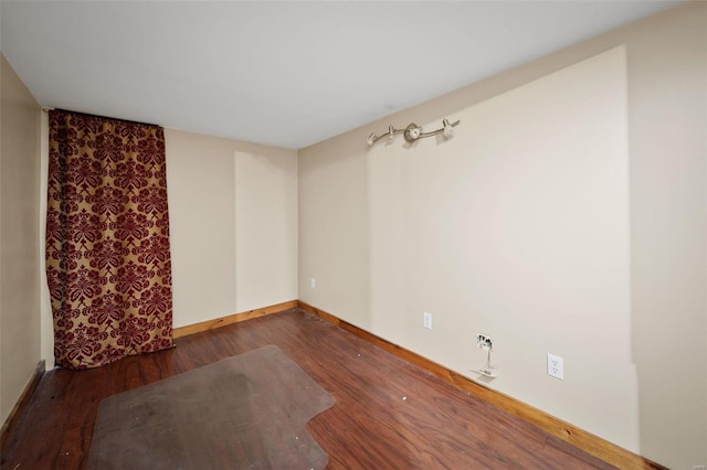 empty room featuring dark hardwood / wood-style floors