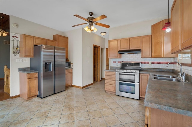 kitchen featuring appliances with stainless steel finishes, tasteful backsplash, ceiling fan, sink, and light tile patterned floors