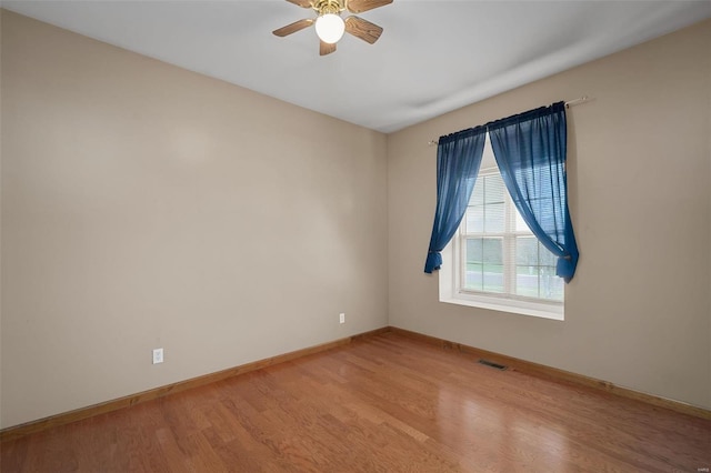 unfurnished room featuring ceiling fan and light hardwood / wood-style floors