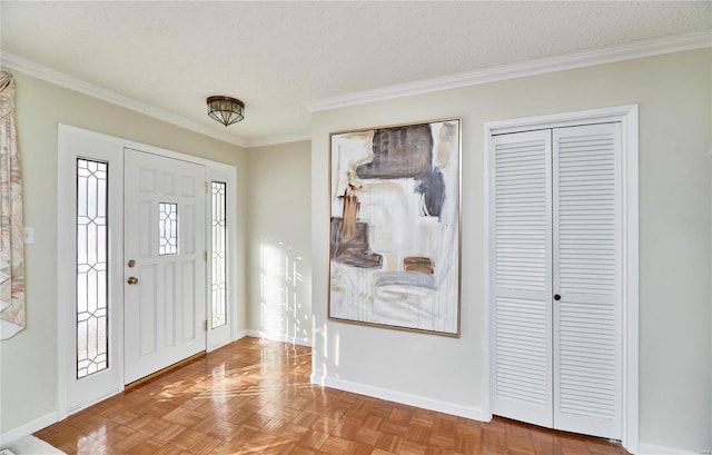 foyer with parquet flooring, plenty of natural light, crown molding, and a textured ceiling