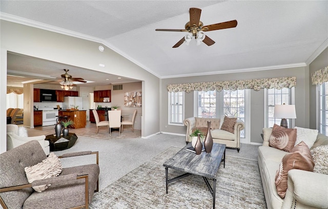 living room with ceiling fan, lofted ceiling, light colored carpet, a textured ceiling, and ornamental molding