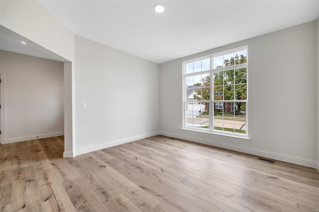 spare room featuring light hardwood / wood-style flooring